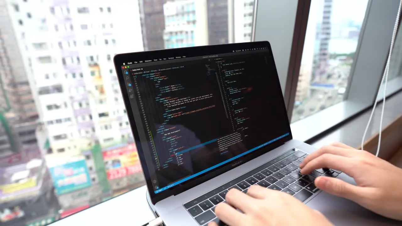 Person coding programming on Visual Studio Code