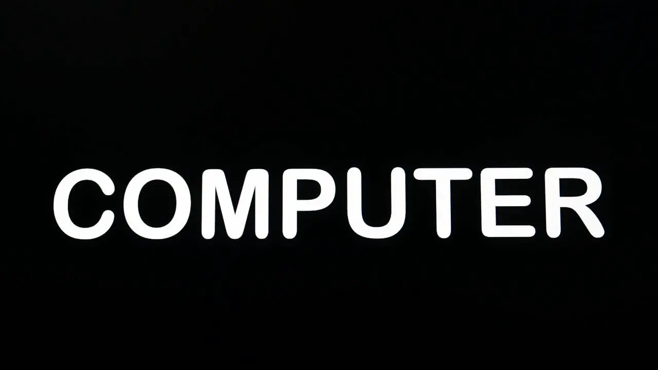 Writing on the screen with a flashing paragraph forming the word computer in white on a black background