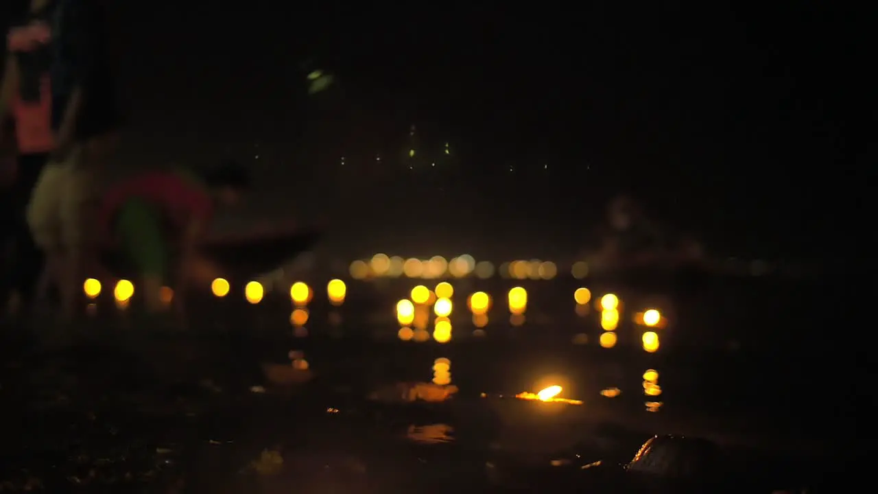 Focus Pull of Puja Candles on the River Ganges