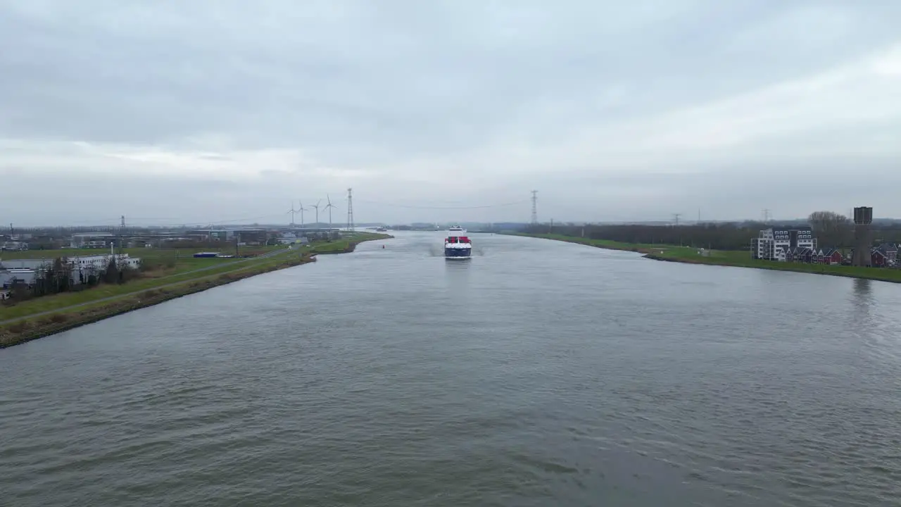 Aerial Flying Over Oude Maas Towards Approaching Cargo Ship In The Distance In Dordrecht