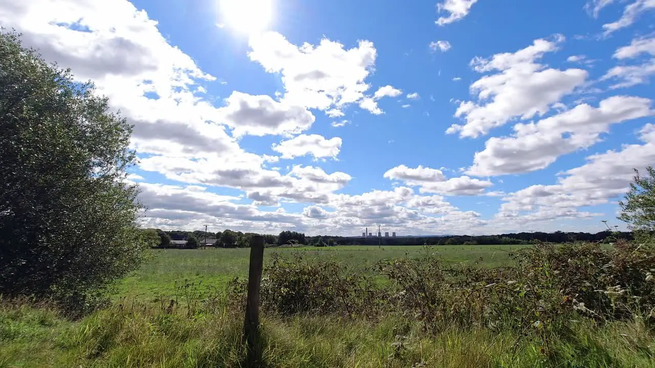 Countryside English farmland timelapse clouds passing across sunny cloudy sky