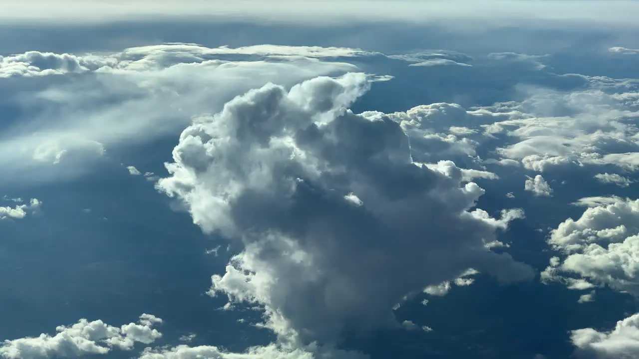 Aerial view of a tiny cumulus cloud recorded from a jet cockpit flying at 12000m high