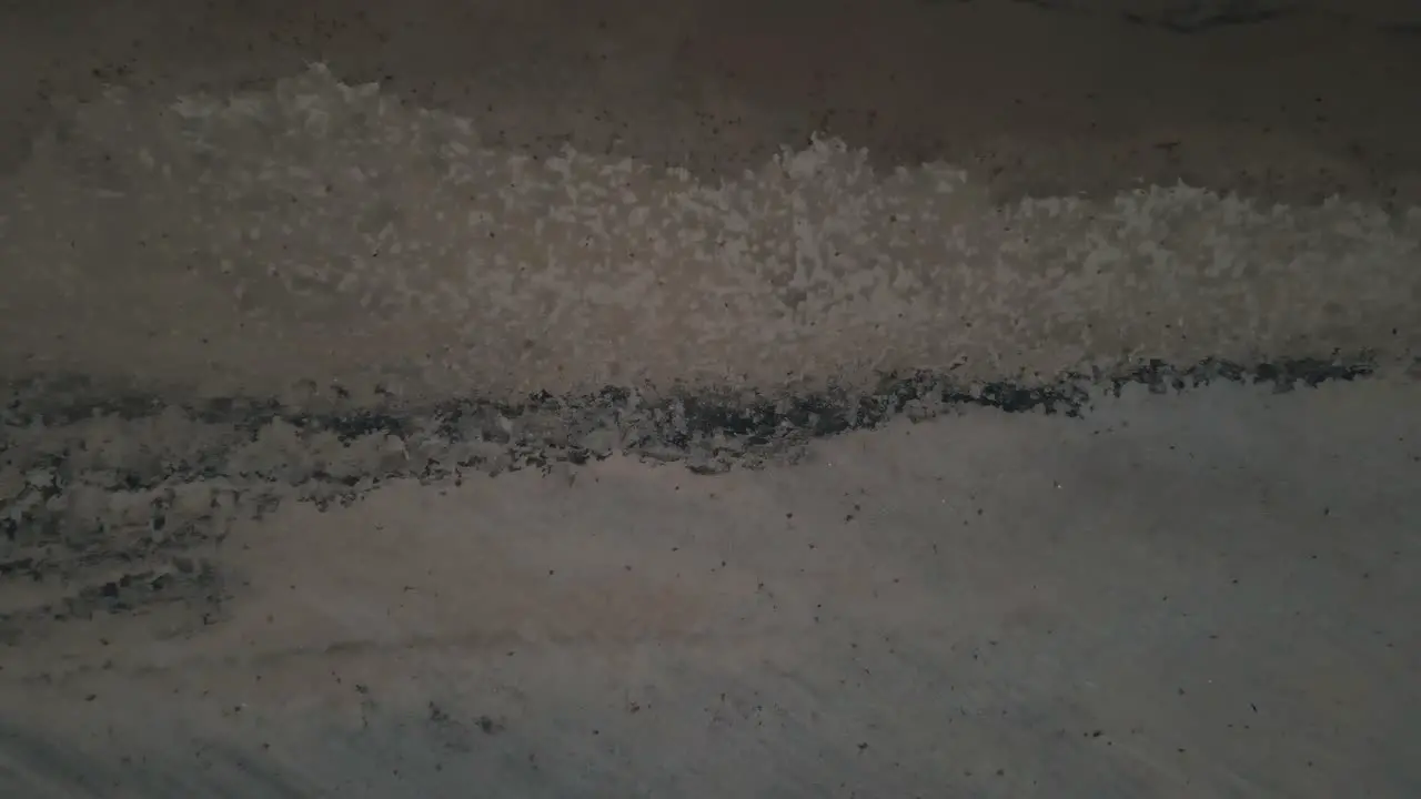 Wet sand in bird's eye view on Lake Michigan