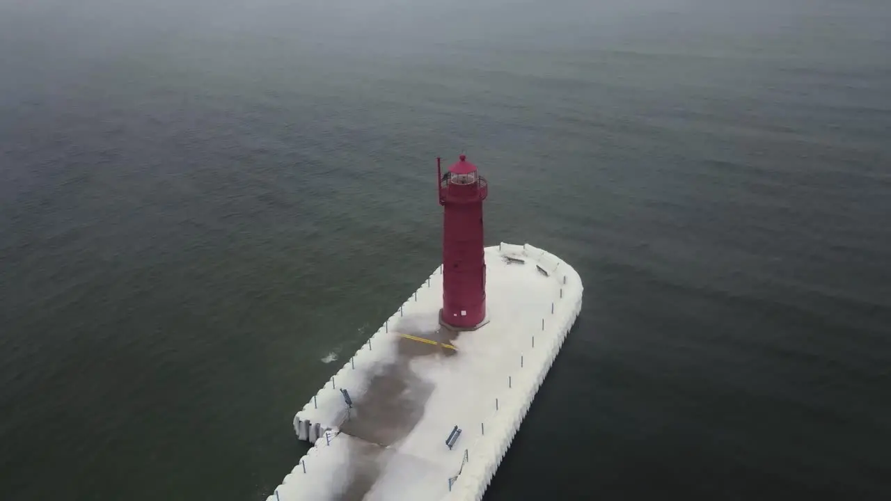 An Ice storm melting into a Heatwave in mid winter near a lighthouse