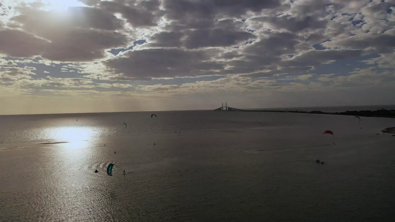 Kite surfers Wind surfers near the Sunshine Bridge in Tampa Bay Florida