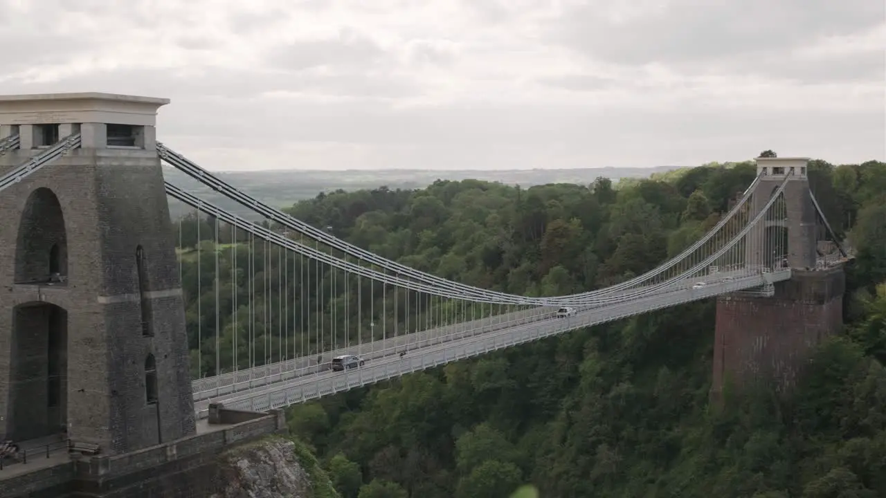 Vehicles passing over the Clifton Suspension Bridge on a cloudy day Bristol England