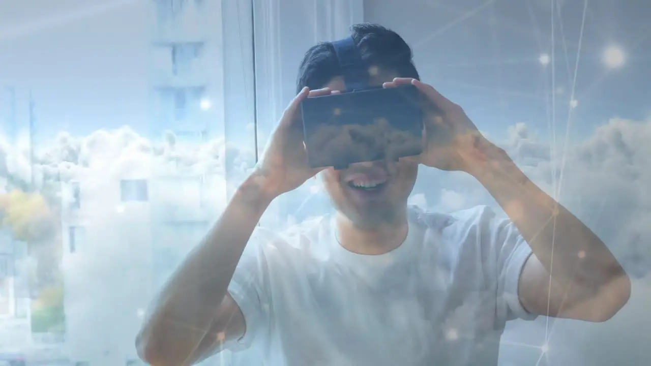 Man wearing a virtual reality headset smiling 4k