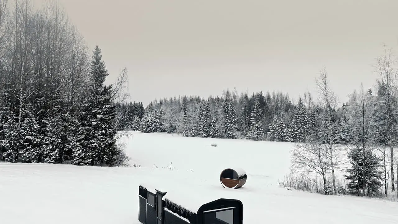 Aerial drone backward moving shot of remote cabin