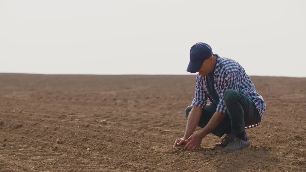 Farmer Hands Holding And Pouring Back Organic Soil 1