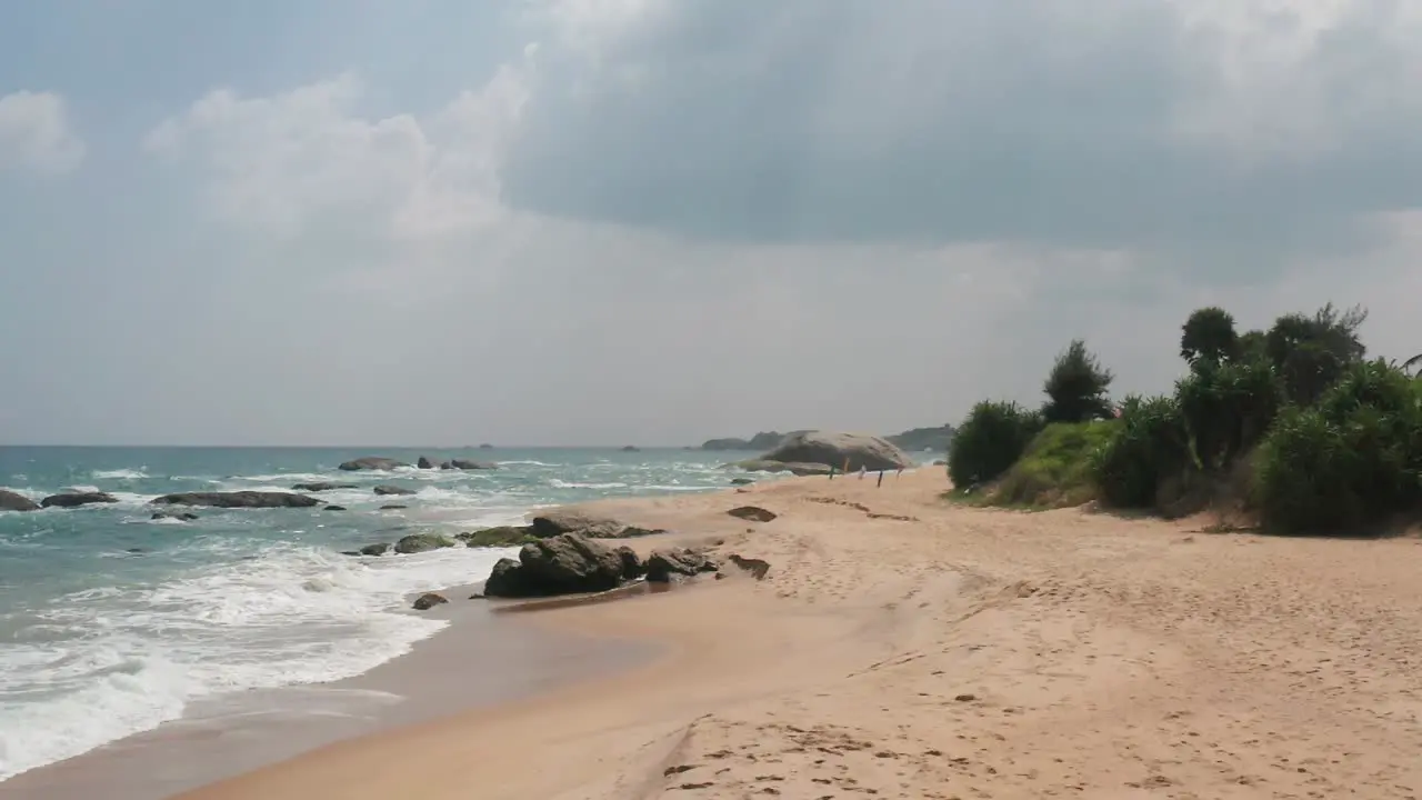 Ocean Waves crushing sandy and rocky coast of South Sri Lanka Awesome Top Drone view