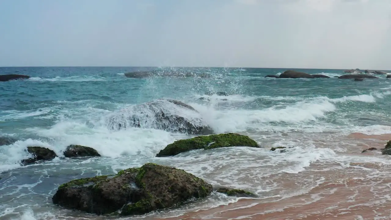 Sea waves crashing on a rock on the coast of Yala Sri Lanka