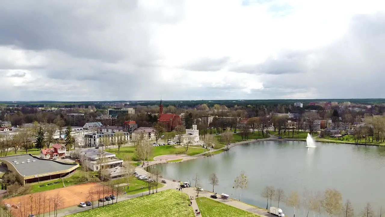 City skyline of Druskininkai in aerial view with dark stormy clouds