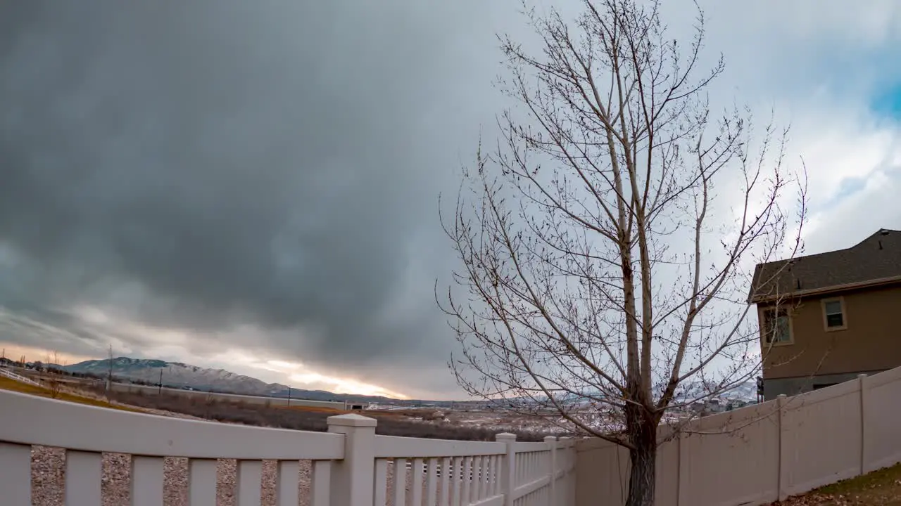 Backyard time lapse on an overcast day static wide angle