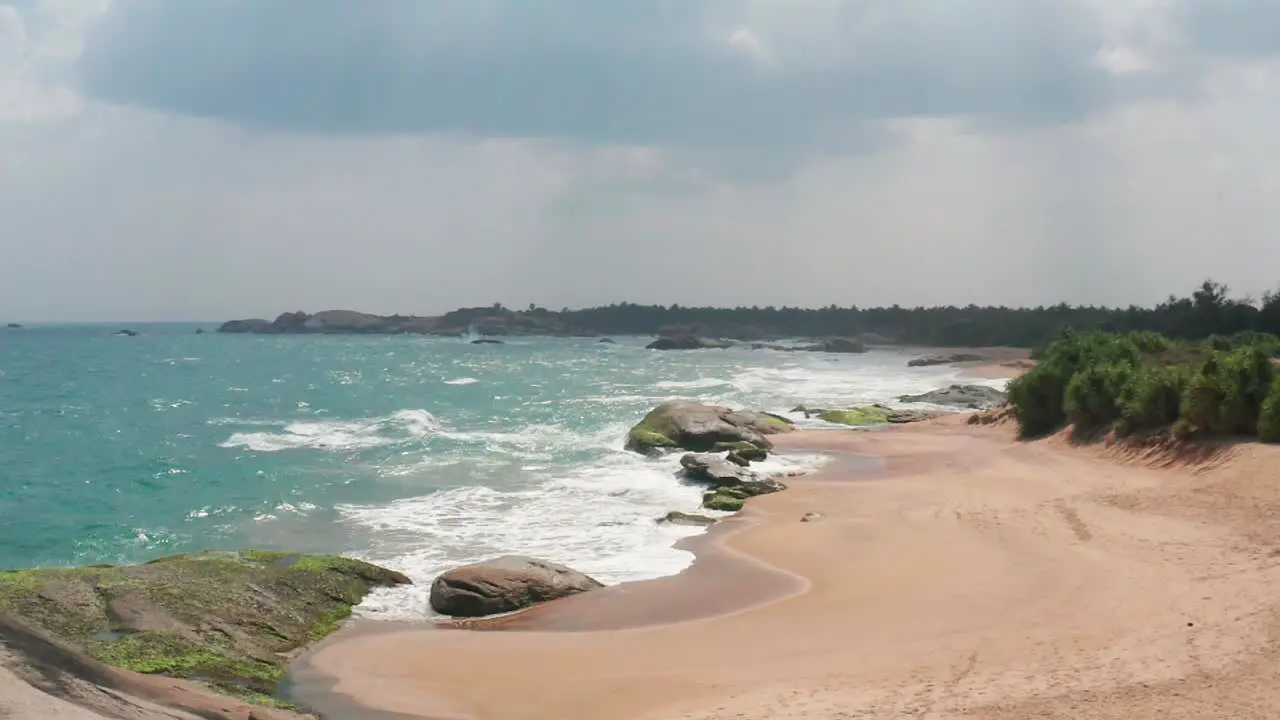 Ocean Waves crushing sandy and rocky coast of Sri Lanka Awesome Top Drone view