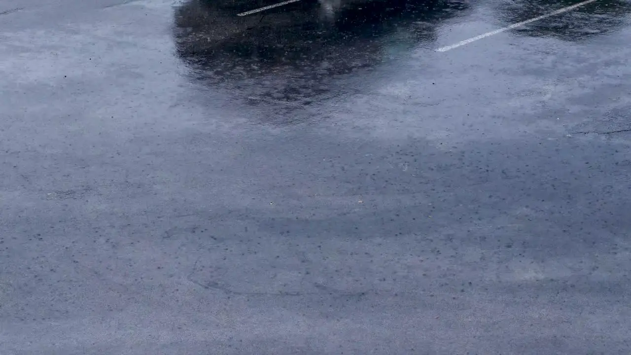 Flowing rain on parking lot