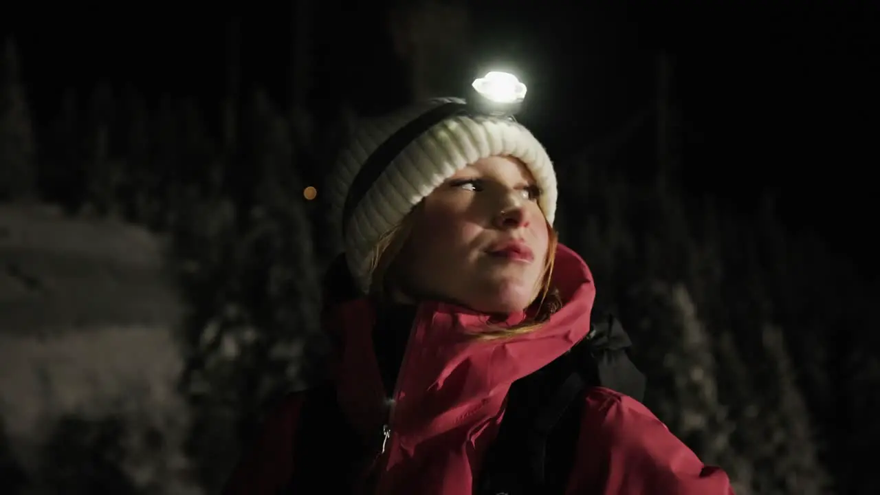 Caucasian Girl Wearing A Headlamp Outdoors At Night