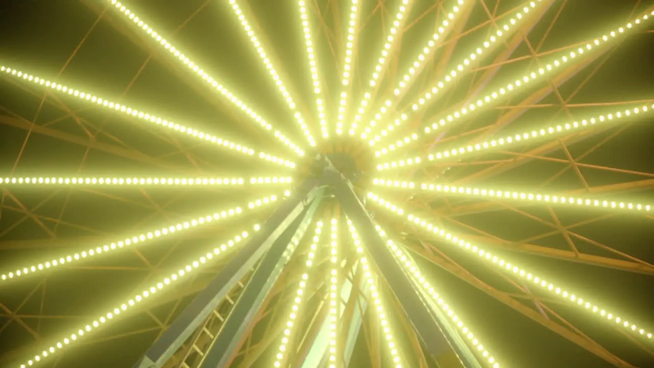 A carousel at a fairground with colored flashing lights