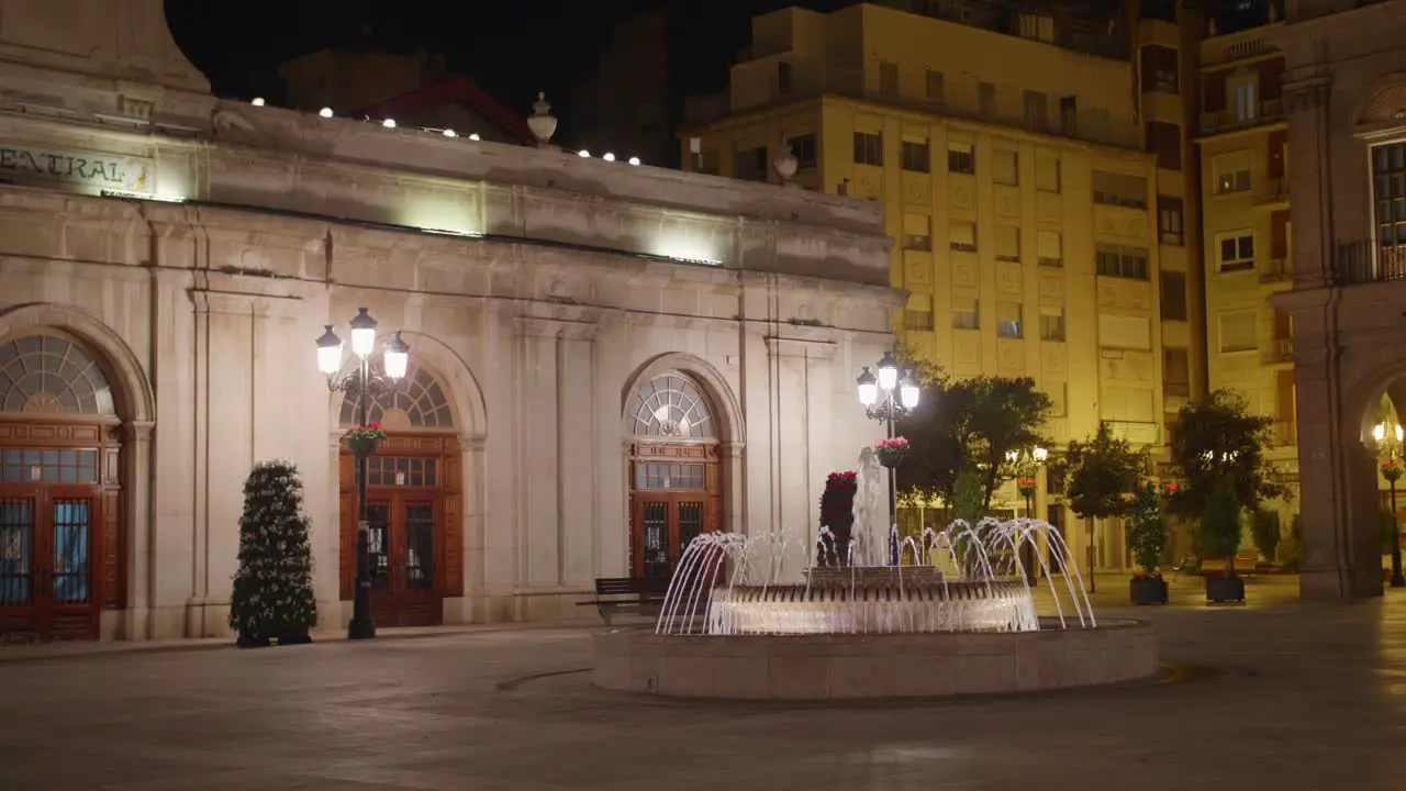 Iconic Fountain And Illuminated Building Of Central Market In Plaza Mayor Castellon de la Plana Castello Spain At Nighttime