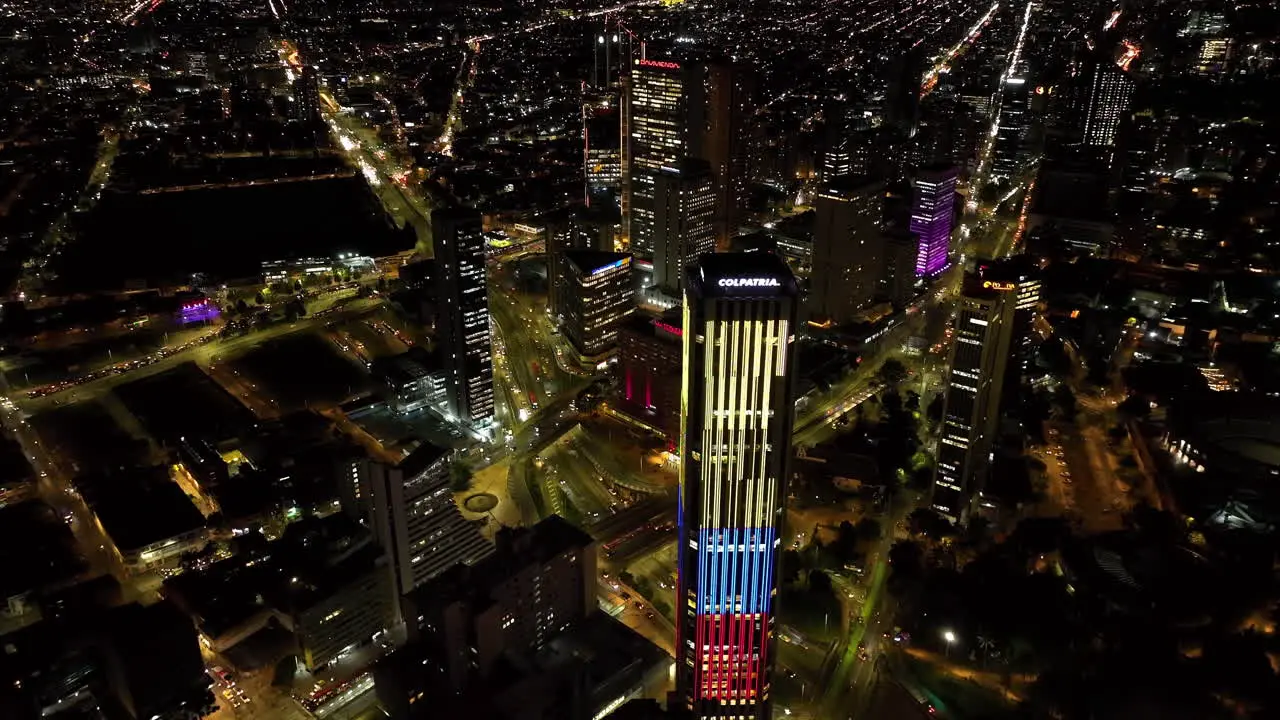 Aerial view backwards away from the Colpatria tower night in Bogota Colombia