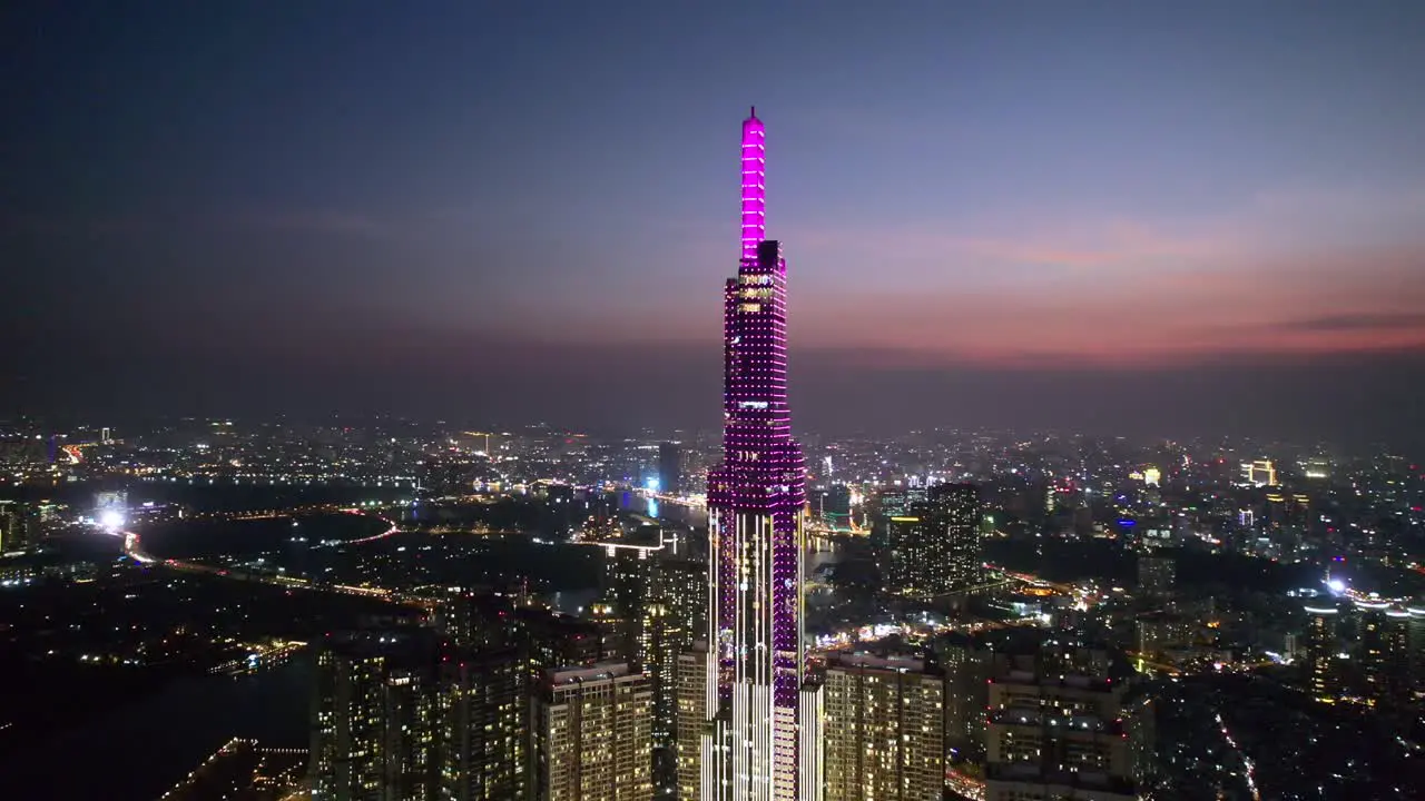 aerial close up of Landmark 81 in Ho Chi Minh City Vietnam surrounded by modern skyline at night