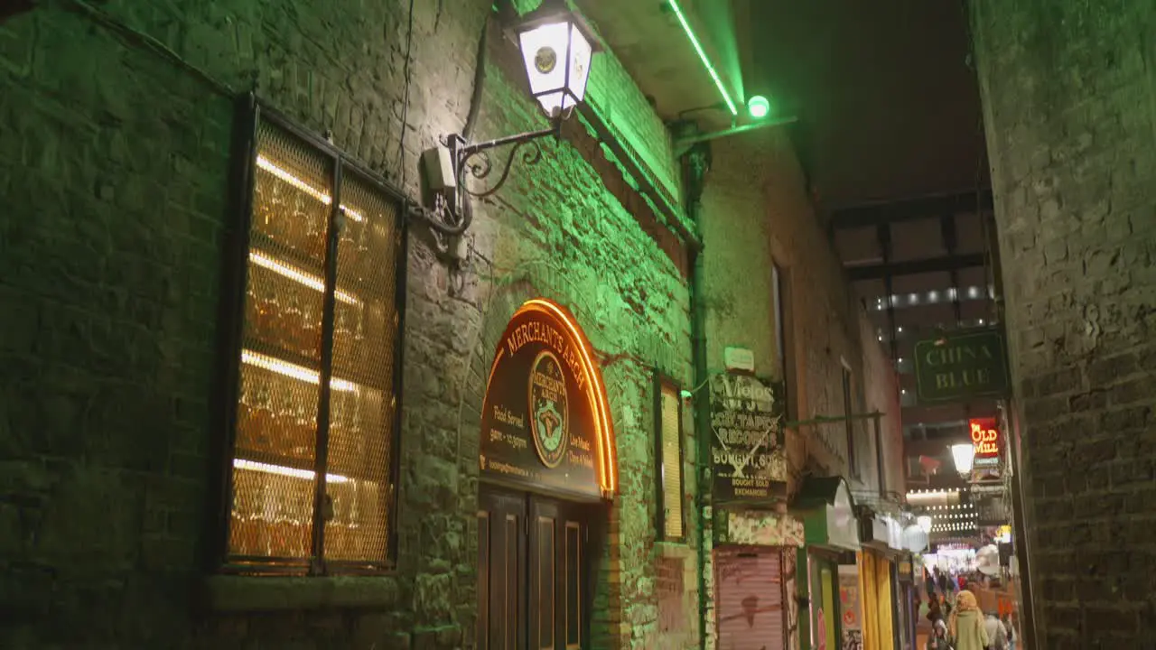 Establisher entrance to famous Merchants Arch Bar and Restaurant in the night