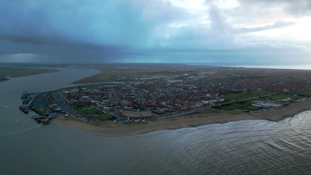 English fishing port peninsula pan with stormy skies in distance near Fleetwood UK