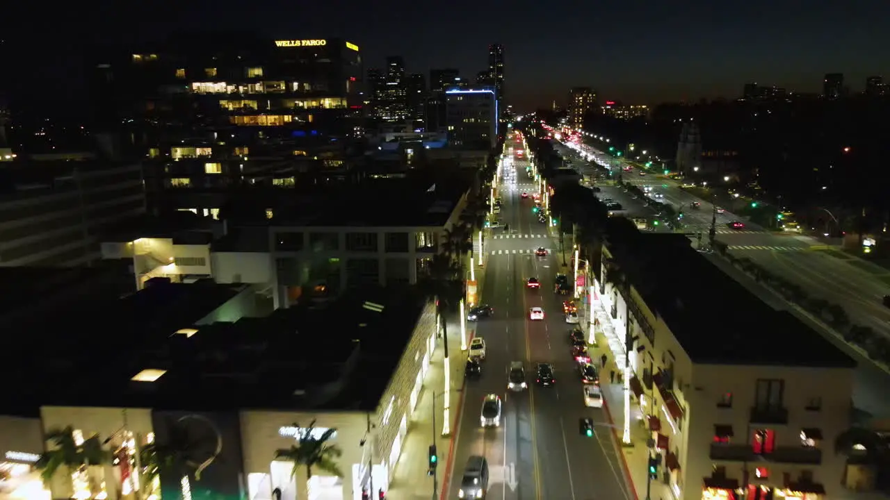 Aerial view over traffic on the illuminated streets of Beverly Hills night in LA