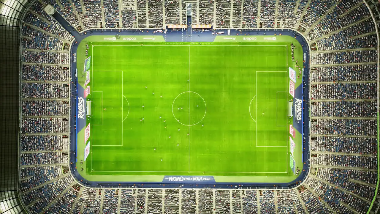 Aerial view above the Estadio BBVA stadium during game night in Monterrey Mexico top down drone shot