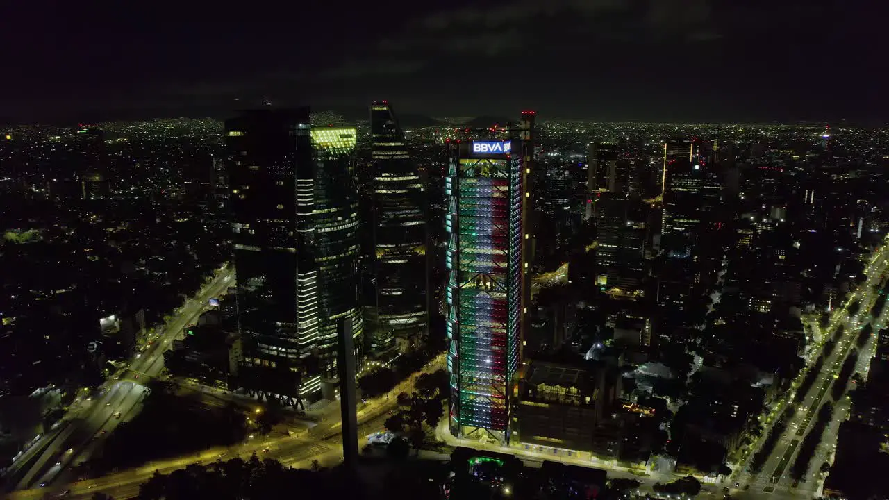 BBVA building and Reforma avenue Independence day night in Mexico city aerial view