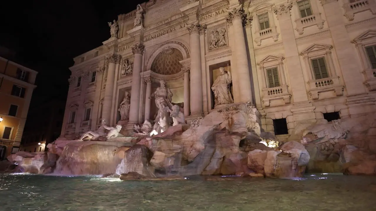 Trevi Fountain in Rome Italy Tilt up in slow motion at Night