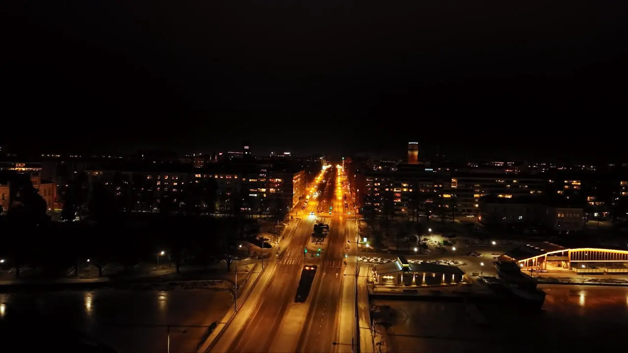 Aerial view flyíng along the quiet E12 esplanade night in Vaasa Finland