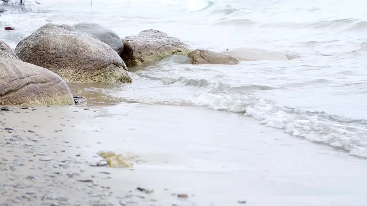 Small waves breaking over rocks on Lake Heron