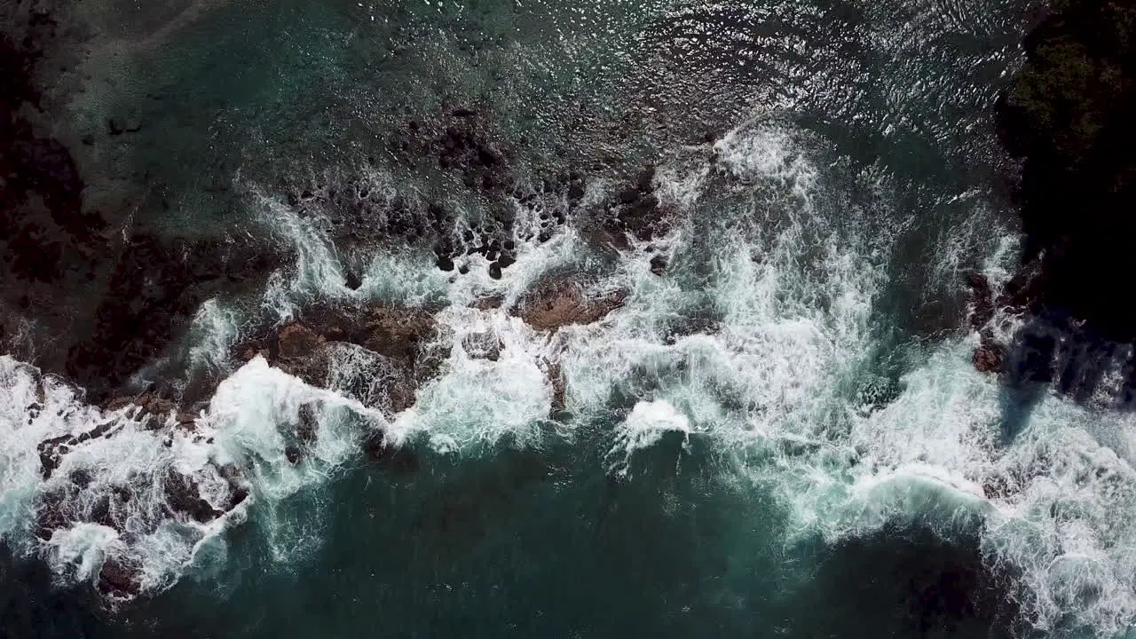 Hawaii waves breaking against rocks