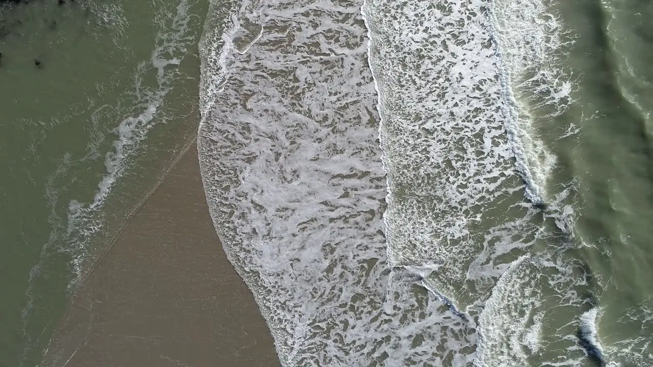 Waves at the beach drone footage sky vieuw in the netherlands