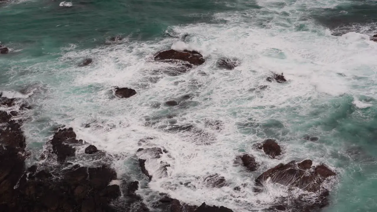 Peaceful calming Footage of beautiful blue ocean waves crashing the rocky shore at Loch Ard Gorge 12 Apostles Coast and Hinterland Port Campbell