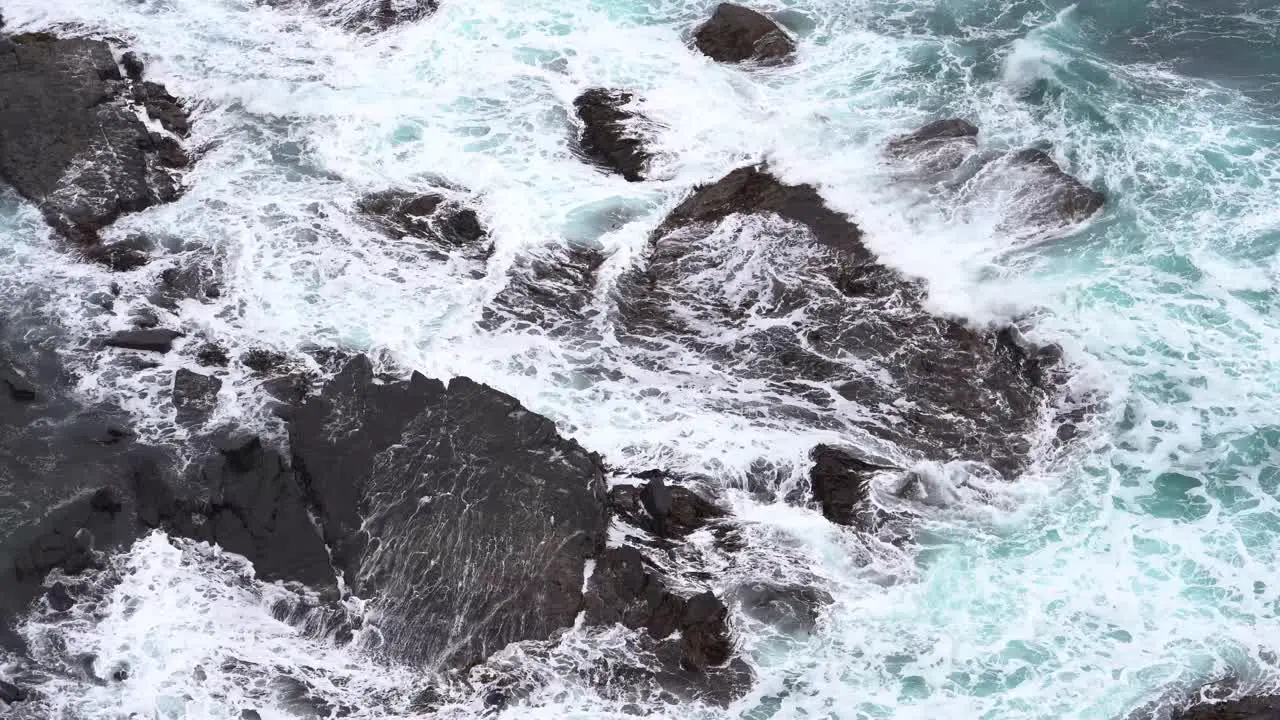 Footage of beautiful blue ocean waves crashing the rocky shore at Loch Ard Gorge 12 Apostles Coast and Hinterland Port Campbell