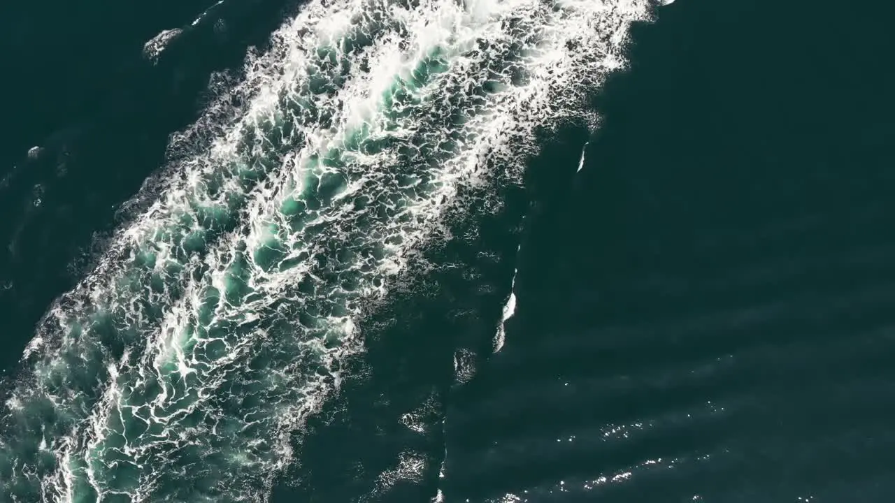 The Cool White Waves Of Sea Waters In Lysekil Sweden After A Vessel Passed By Aerial Shot