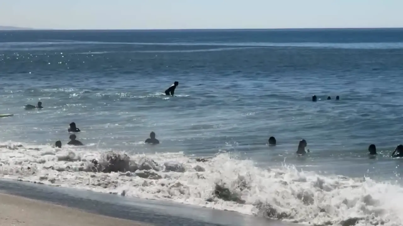 HD Footage of people playing at the beach on a beautiful sunny day