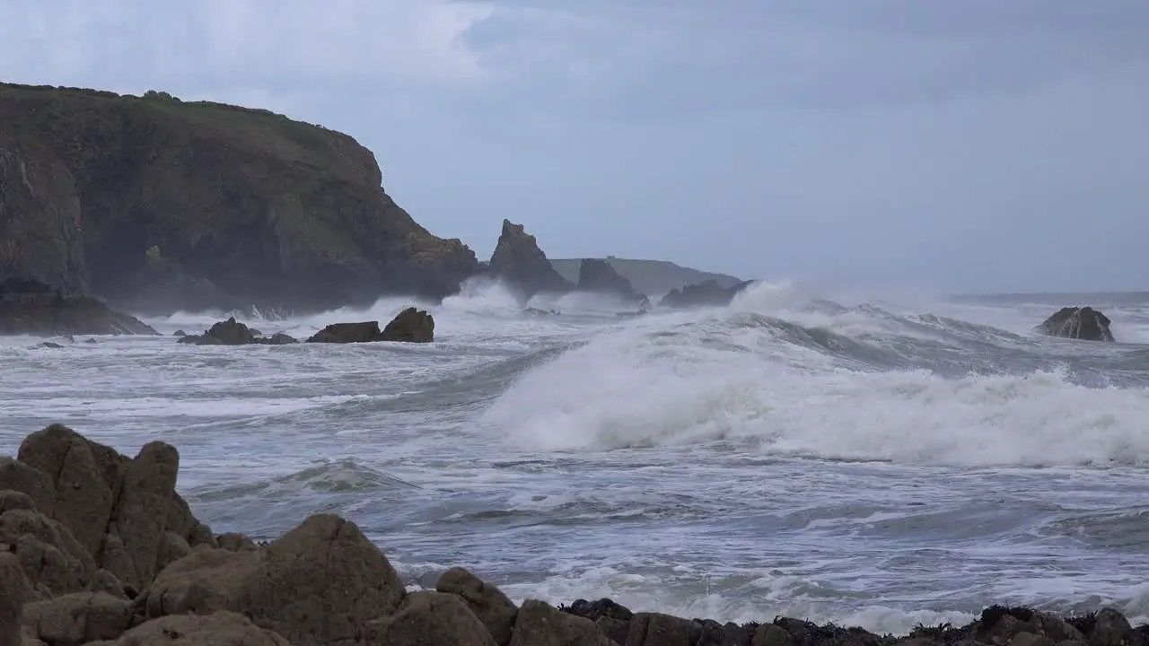 winter storm rough seas high waves rugged coastline Copper Coast Waterford Ireland in a winter storm