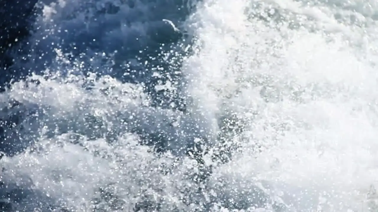 Water Rushes by on Side of Boat