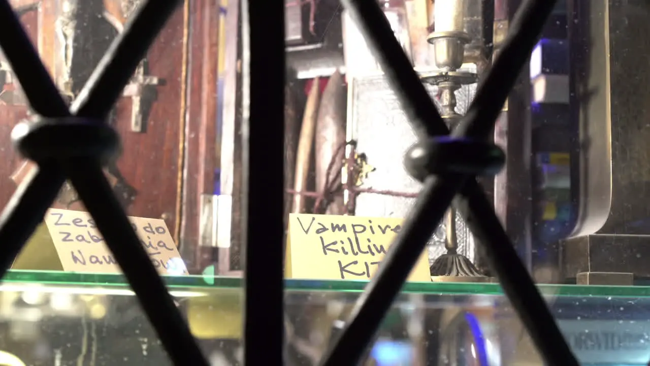 Close up of shop window selling vampire killing kit in Warsaw old town 4k