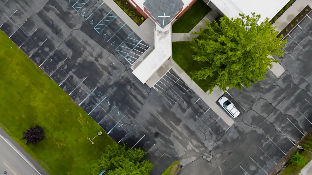 High angle tilt to top down over a church