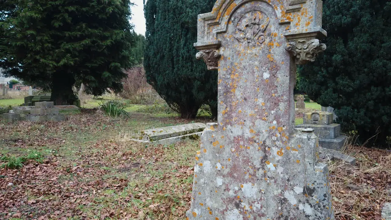 Old weathered grave headstone in a church yard