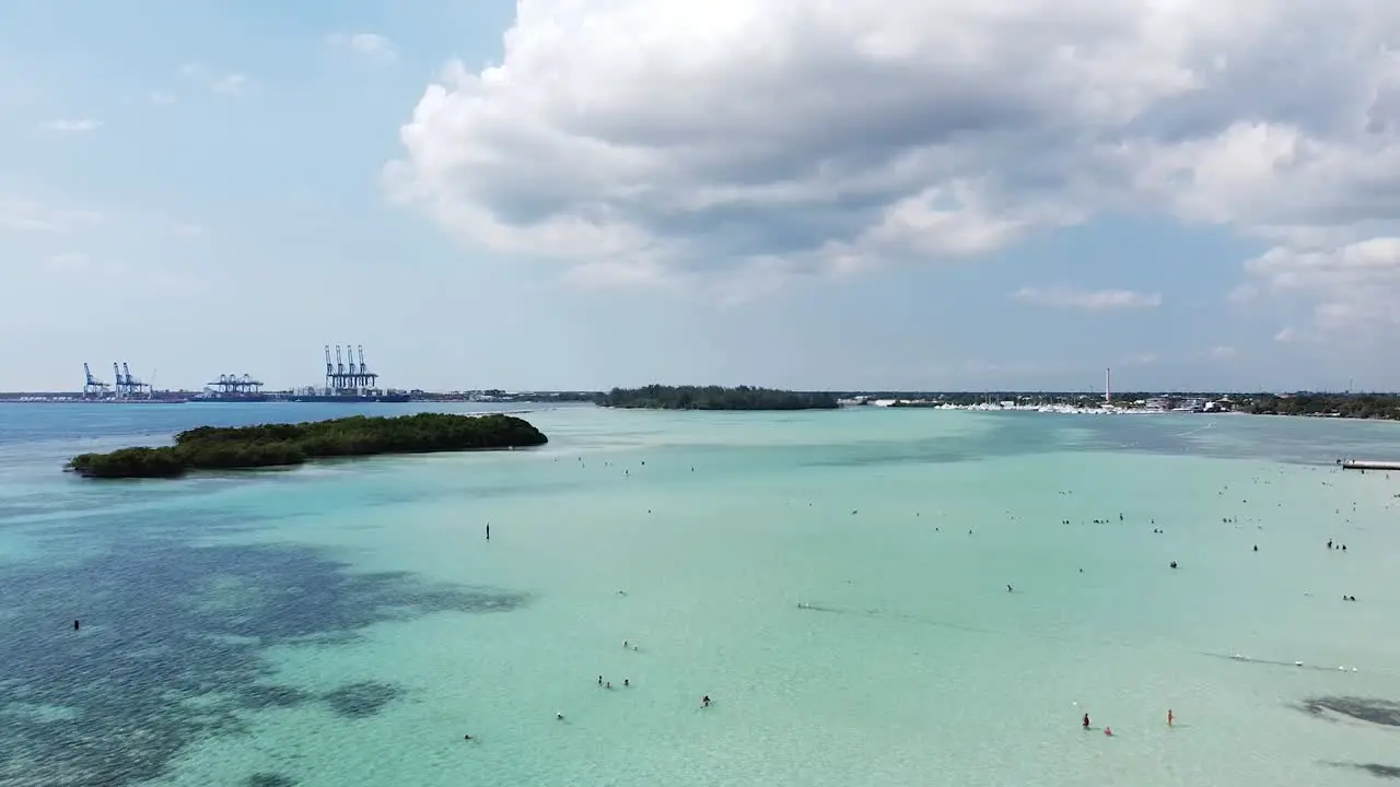 Aerial view over boca chica beach with beautiful view to the horizon and small islands in the background beautiful sunny day with blue sea