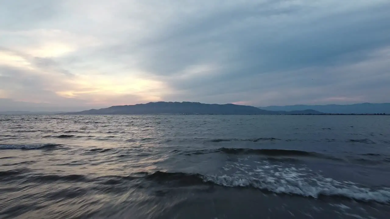 drone flight over the sea at sunset