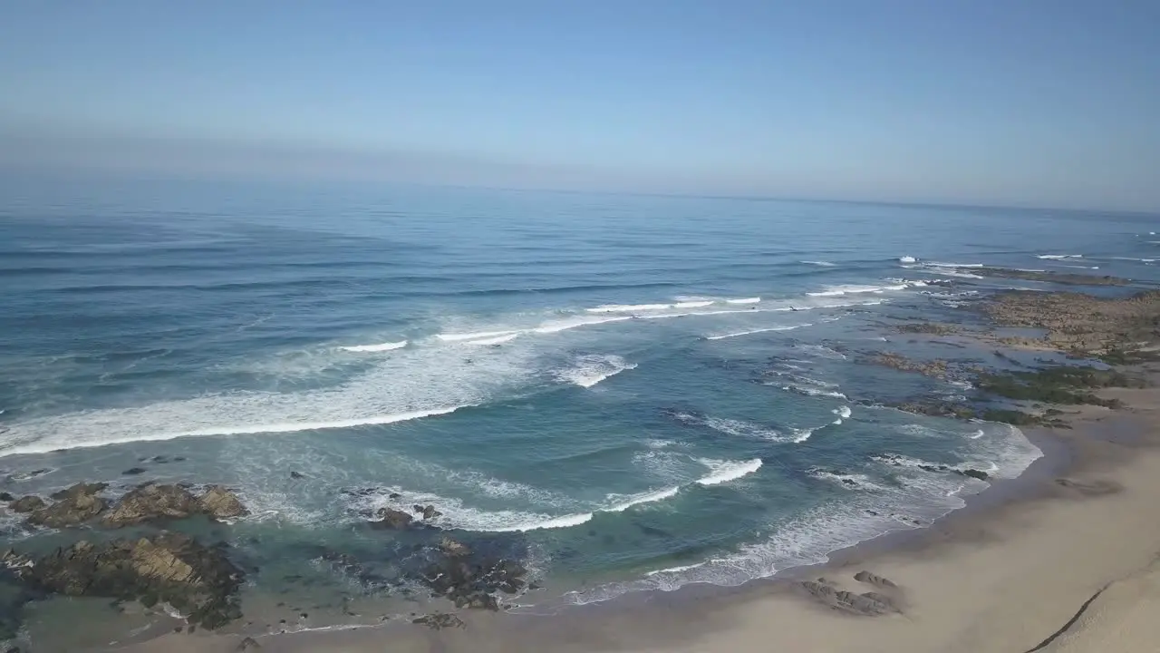 Aerial Top View Of Sea Waves Reaching Beach Shore Drone Footage