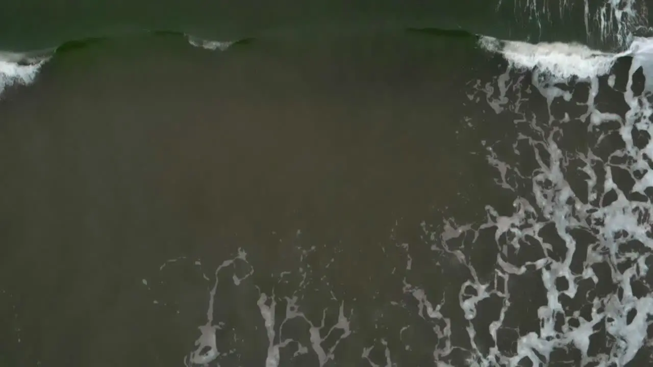 Aerial top shot of waves in slow motion