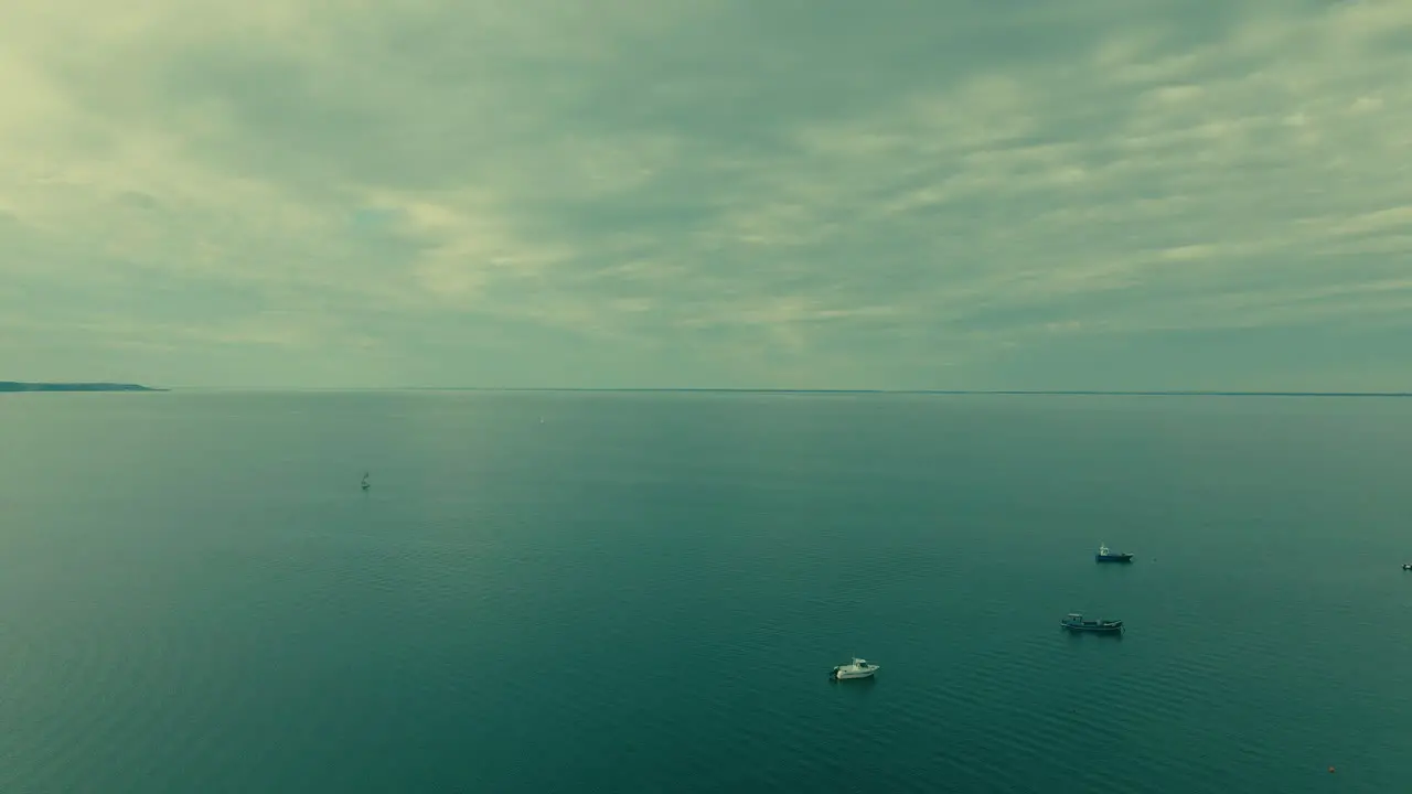 Aerial panorama shot showing endless baltic sea and driving boats Poland