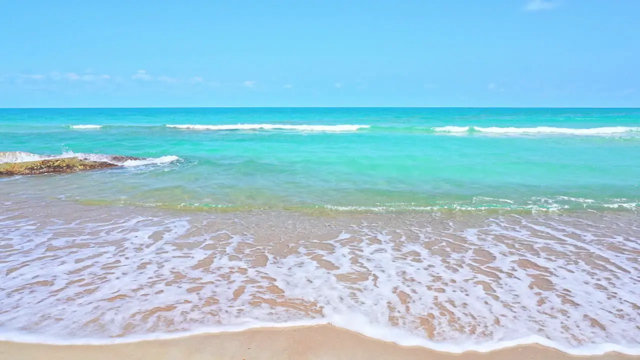 Vibrant color contrast of golden beach with turquoise water