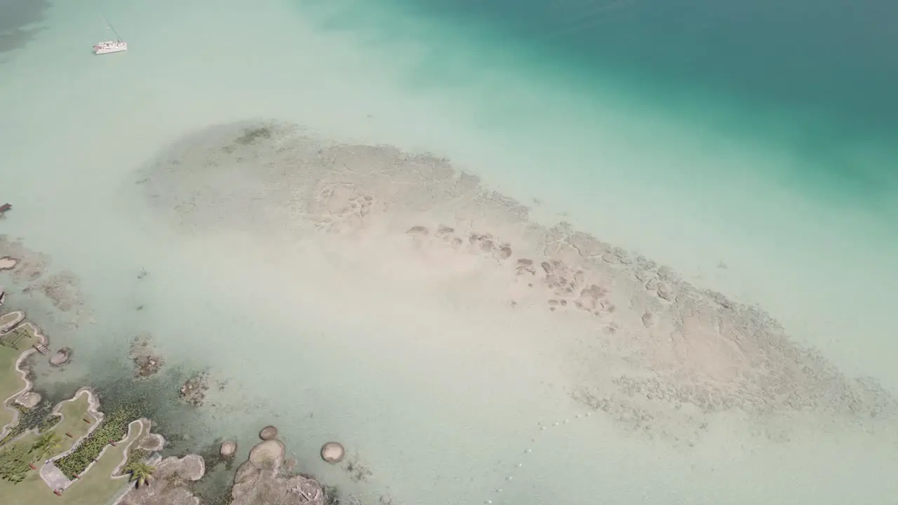 Aerial View Of Shallow Crystal-clear Water Of Beach With Jetty During Summer In Mexico